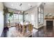 Bright dining room with large windows and a modern dining table at 8303 Bramfield Dr, Huntersville, NC 28078