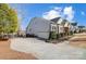 Gray house with a two-car garage and manicured landscaping at 8303 Bramfield Dr, Huntersville, NC 28078