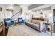 Open concept living room with a view into the kitchen and staircase at 8303 Bramfield Dr, Huntersville, NC 28078