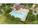 Community pool with a clubhouse and surrounding lounge areas at 8303 Bramfield Dr, Huntersville, NC 28078