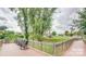 Picturesque view of green spaces and community features from wooden walkway at 85 5Th St, Cramerton, NC 28032