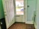 Entryway featuring old door and wood floors, plus view to the outdoors at 85 5Th St, Cramerton, NC 28032