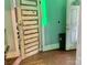 Entryway with hardwood floors featuring an old white painted door at 85 5Th St, Cramerton, NC 28032