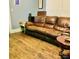 Living room with a brown leather couch at 85 5Th St, Cramerton, NC 28032