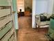 A view from the door to the living room with hardwood floors and furniture at 85 5Th St, Cramerton, NC 28032