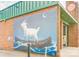 Exterior brick wall featuring a goat mural that adds unique charm to the building's facade at 85 5Th St, Cramerton, NC 28032