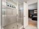 Spa-like bathroom with a walk-in shower and built-in bench at 8903 Ansley Park Pl, Huntersville, NC 28078