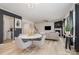 Modern dining room with white table and gray chairs near the kitchen at 8903 Ansley Park Pl, Huntersville, NC 28078