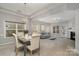 Elegant dining room with chandelier and adjacent living room at 9538 Skybluff Cir, Huntersville, NC 28078