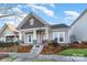 Craftsman style home with stone accents and a welcoming front porch at 9538 Skybluff Cir, Huntersville, NC 28078