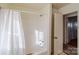 Clean bathroom with a shower/tub combo and white tile at 10006 Feldbank Dr, Charlotte, NC 28216