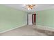 Bedroom featuring green walls, carpet flooring and multiple doors at 111 Wheaton Ct, Salisbury, NC 28147