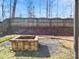 Backyard with fire pit and wooden fence at 11627 Tribal Dr, Charlotte, NC 28214