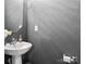Simple bathroom with pedestal sink and gray walls at 11627 Tribal Dr, Charlotte, NC 28214