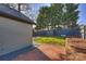 Brick patio and fenced backyard with storage shed at 1204 Buchanan St, Charlotte, NC 28203