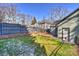 Large backyard with a fence, landscaping, and patio at 1204 Buchanan St, Charlotte, NC 28203
