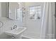 Simple bathroom with shower/tub combo and white tile at 1204 Buchanan St, Charlotte, NC 28203