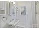 Simple bathroom with shower/tub combo and white tile at 1204 Buchanan St, Charlotte, NC 28203