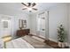 Virtually staged bedroom with hardwood floors and ceiling fan at 1204 Buchanan St, Charlotte, NC 28203