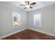 Cozy bedroom with hardwood floors and ceiling fan at 1204 Buchanan St, Charlotte, NC 28203