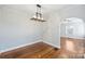 Dining room with hardwood floors and view into living room at 1204 Buchanan St, Charlotte, NC 28203