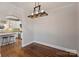 Bright dining room with hardwood floors and a view of the kitchen at 1204 Buchanan St, Charlotte, NC 28203