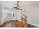 Dining room features hardwood floors, bay window, and an archway to the kitchen at 1204 Buchanan St, Charlotte, NC 28203