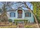 Charming light blue brick home with manicured landscaping and brick walkway at 1204 Buchanan St, Charlotte, NC 28203