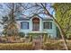 Charming light blue brick home with manicured landscaping and brick walkway at 1204 Buchanan St, Charlotte, NC 28203