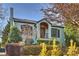 Charming light blue brick home with manicured landscaping and brick walkway at 1204 Buchanan St, Charlotte, NC 28203