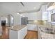 Bright kitchen featuring granite island and white cabinets at 1204 Buchanan St, Charlotte, NC 28203