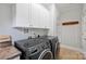 Laundry room with washer, dryer, and ample cabinet space at 1204 Buchanan St, Charlotte, NC 28203
