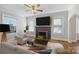 Virtually staged living room with fireplace and hardwood floors at 1204 Buchanan St, Charlotte, NC 28203