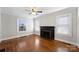 Spacious living room with hardwood floors, fireplace, and large windows at 1204 Buchanan St, Charlotte, NC 28203