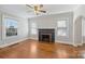 Spacious living room with hardwood floors, fireplace, and large windows at 1204 Buchanan St, Charlotte, NC 28203