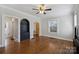 Hardwood floors, built-in shelving and a view into another room are featured in this living room at 1204 Buchanan St, Charlotte, NC 28203