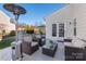 Relaxing back patio with seating area and grill at 1216 Longwall Ln, Matthews, NC 28105