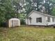 Backyard view of the house with a storage shed at 1300 Brookdale St, Kannapolis, NC 28083