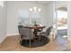 Bright breakfast nook features a round table and four chairs, offering a casual dining space at 1308 Black Walnut St, Monroe, NC 28112