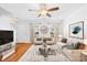 Virtually staged living room with neutral decor and hardwood floors at 13449 Glenwyck Ln, Huntersville, NC 28078