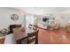 Bright dining room with wood table and adjacent living area at 13470 Austin Rd, Locust, NC 28097