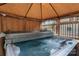 Relax in this covered hot tub, complete with bubbling jets and a convenient cover at 13470 Austin Rd, Locust, NC 28097