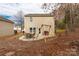 Cozy patio with seating area, grill, and swing set, backing up to wooded area at 1444 Swaying Branch Ln, Clover, SC 29710