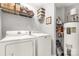 Laundry room with washer, dryer, and shelving for storage at 1444 Swaying Branch Ln, Clover, SC 29710