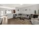 Open concept living room and kitchen with gray sectional sofa at 1444 Swaying Branch Ln, Clover, SC 29710