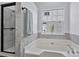 Bathroom featuring a soaking tub and shower at 156 Crestwood Dr, Mount Holly, NC 28120