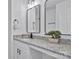 Modern bathroom with granite countertop and black framed mirror at 156 Crestwood Dr, Mount Holly, NC 28120