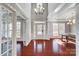 Grand foyer featuring hardwood floors, soaring ceilings, large windows, and elegant chandelier at 2607 Catesby Dr, Waxhaw, NC 28173