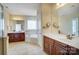 Bright bathroom boasting a large vanity with double sinks, walk-in shower and soaking tub at 2607 White Pines Ct, Monroe, NC 28112