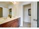 A bathroom with double vanity, tiled floor, and white trim on the walls at 2607 White Pines Ct, Monroe, NC 28112